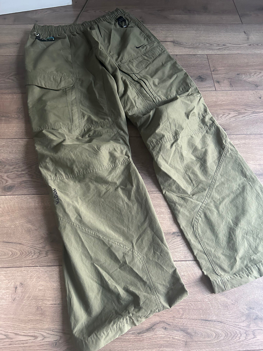 Nike Men's Nocta Open Hem Pant in Medium Olive